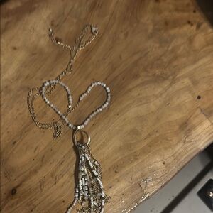 Gold and White Ornate Necklace with Intricate Detailing